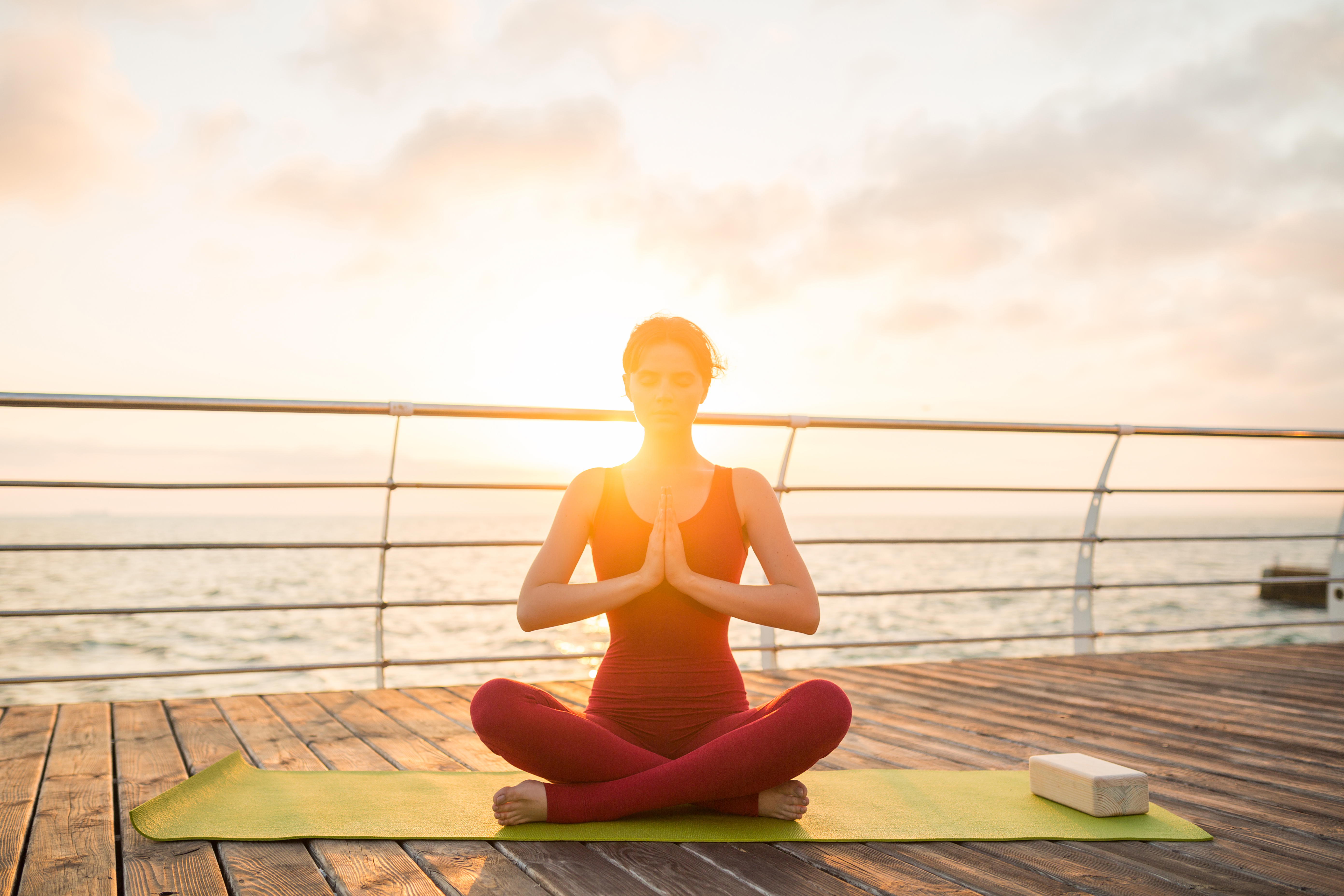 young-slim-beautiful-attractive-woman-doing-yoga-morning-sunrise-by-sea-healthy-lifestyle