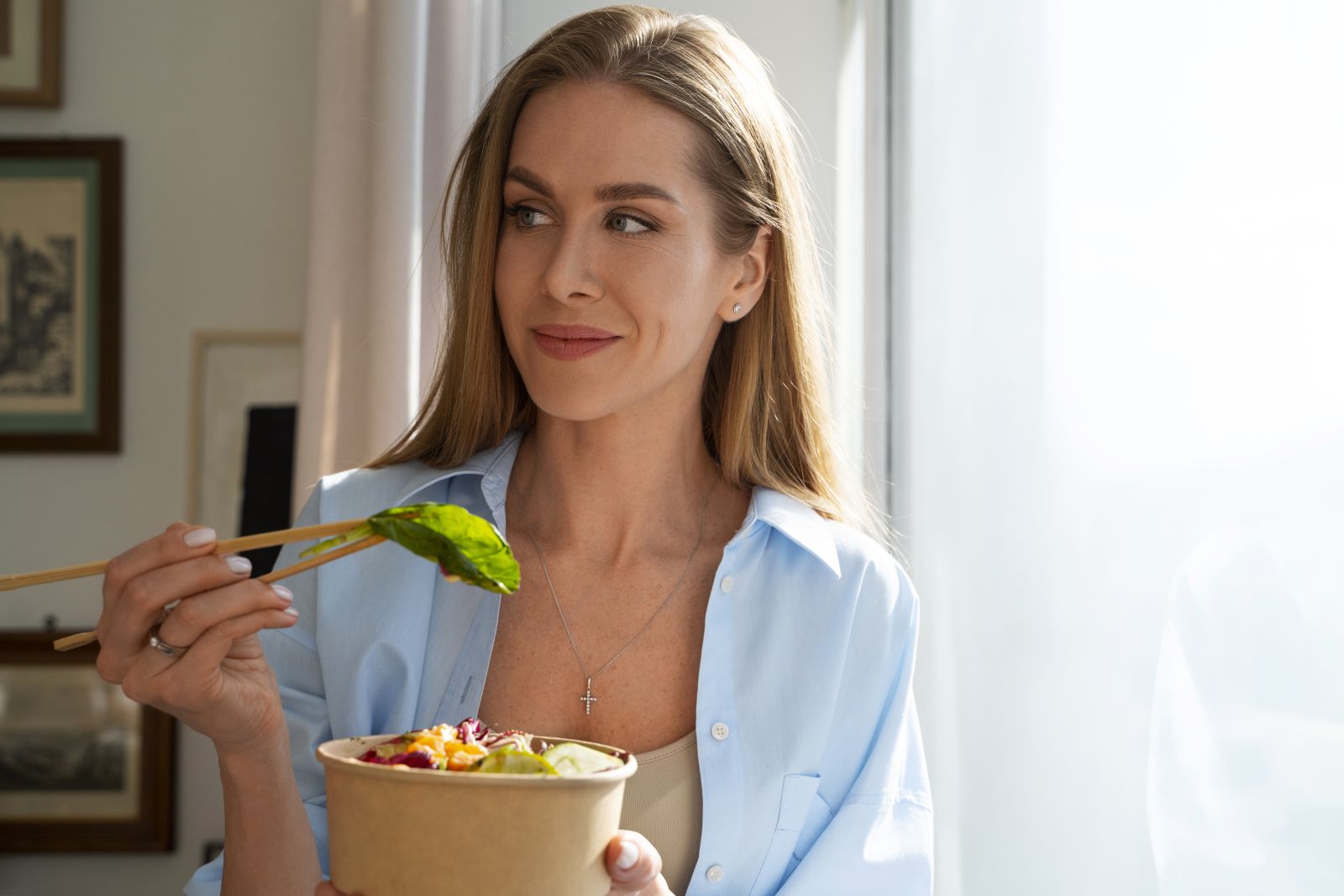 medium-shot-woman-eating-salmon-bowl
