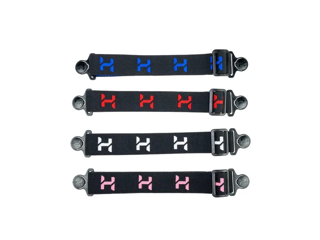 Prehľad farebných variantov elastických remienkov s vyšívaným logom Halcyon a robustným systémom nastavenia pnutia.