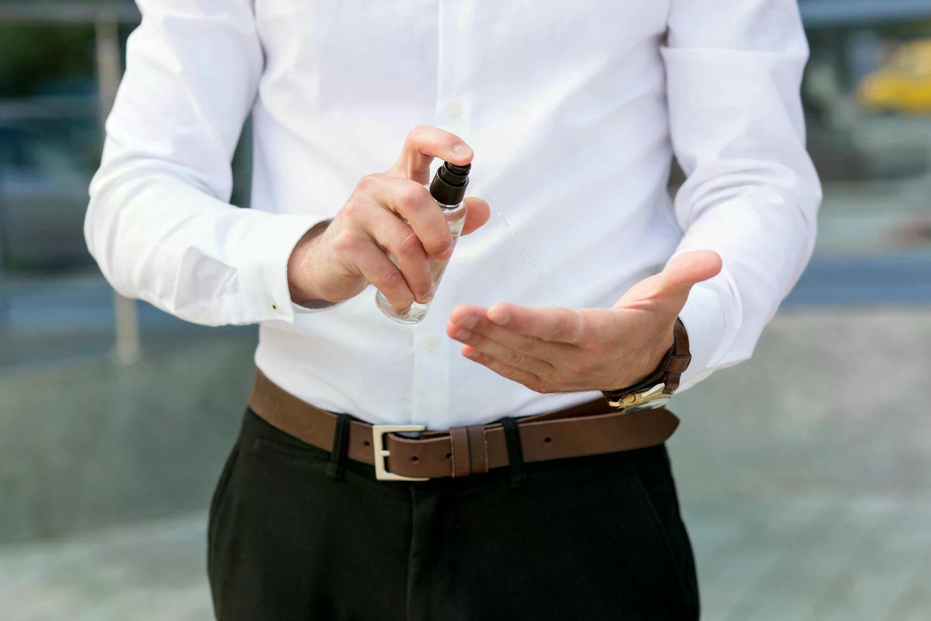 close-up-man-using-hand-sanitizer