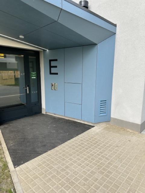 Invisible access panels in the facade of a residential project