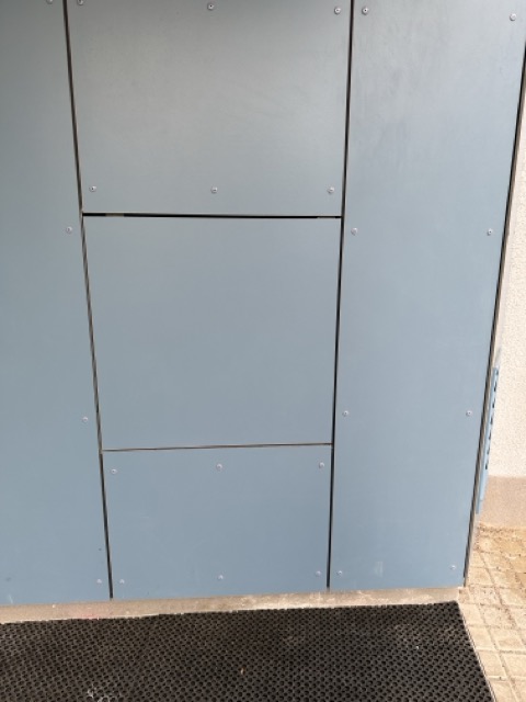 Invisible access panels in the facade of a residential project