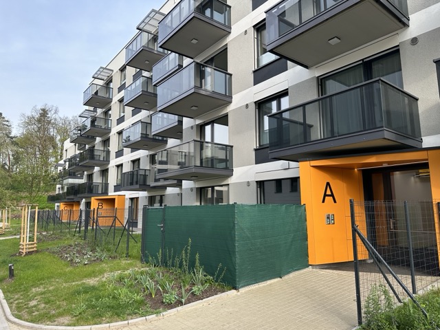 Invisible access panels in the facade of a residential project