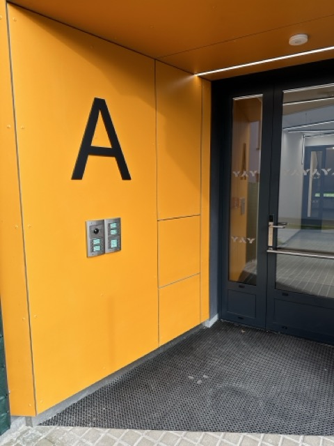 Invisible access panels in the facade of a residential project