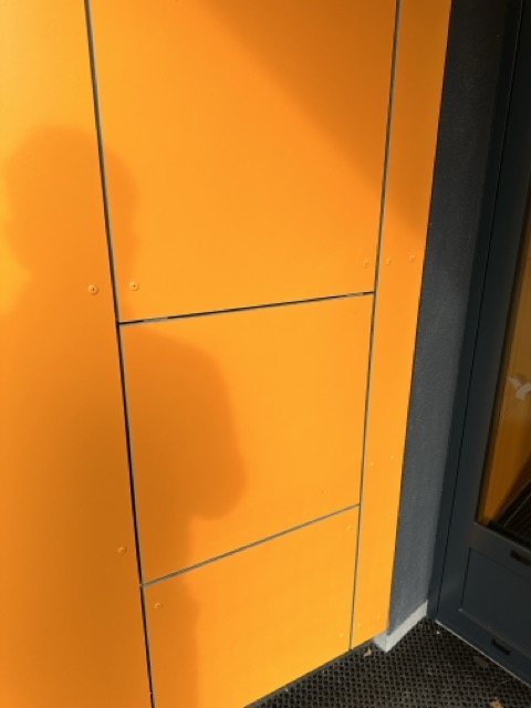 Invisible access panels in the facade of a residential project