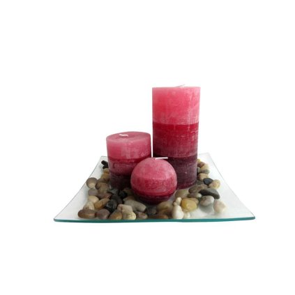 Gift set of 3 cinnamon scented candles on a glass tray with stones.