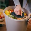Pressing food scraps in Bokashi Organko Essential image web