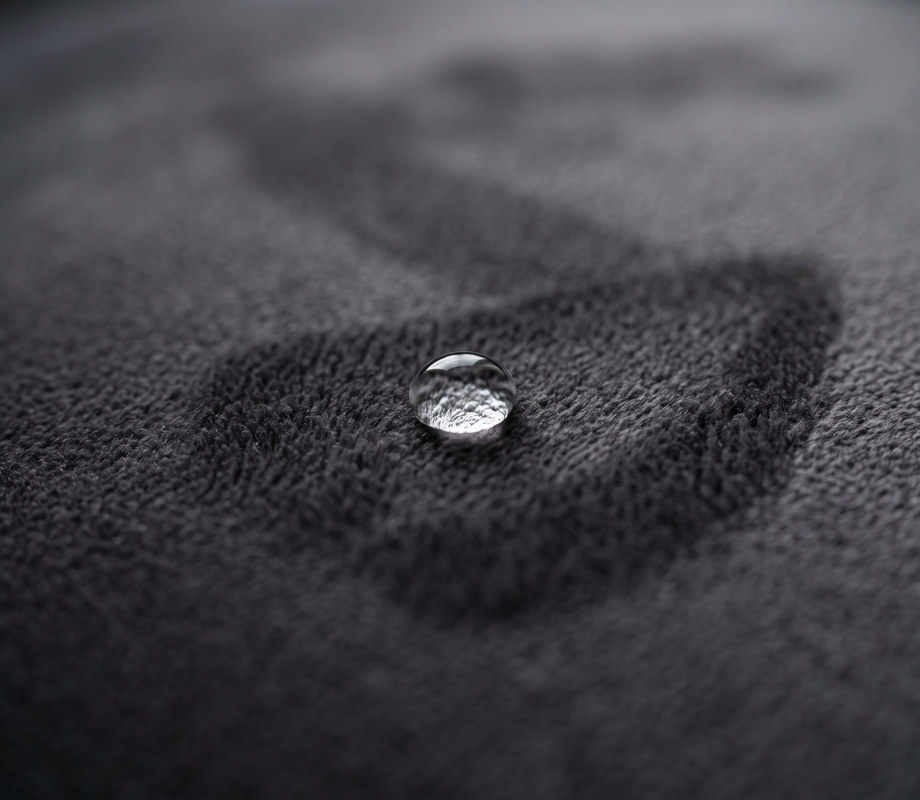 Macro detail of Palladium fabric with a water droplet resting on the surface