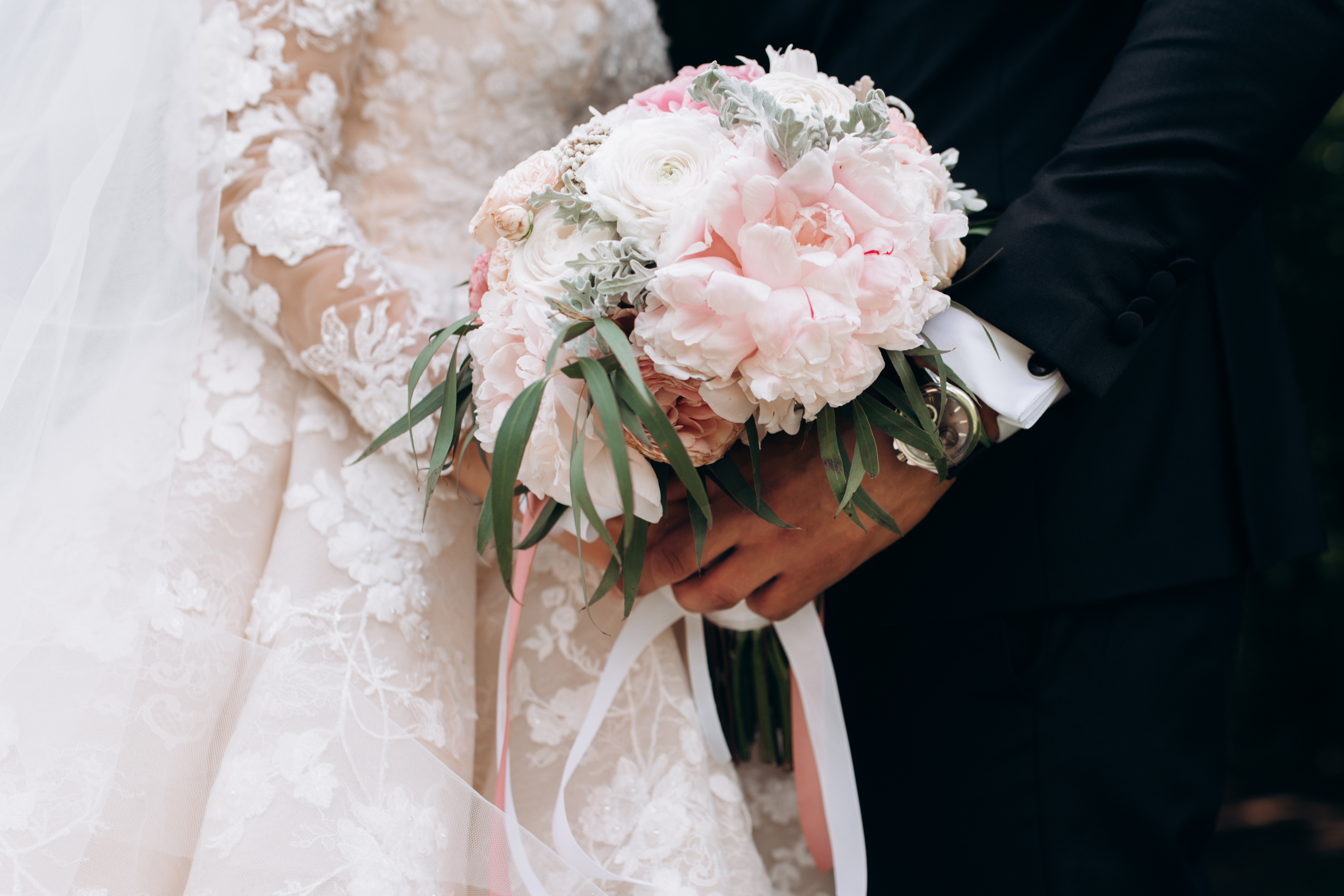 groom-bride-together-are-holding-wedding-pink-bouquet