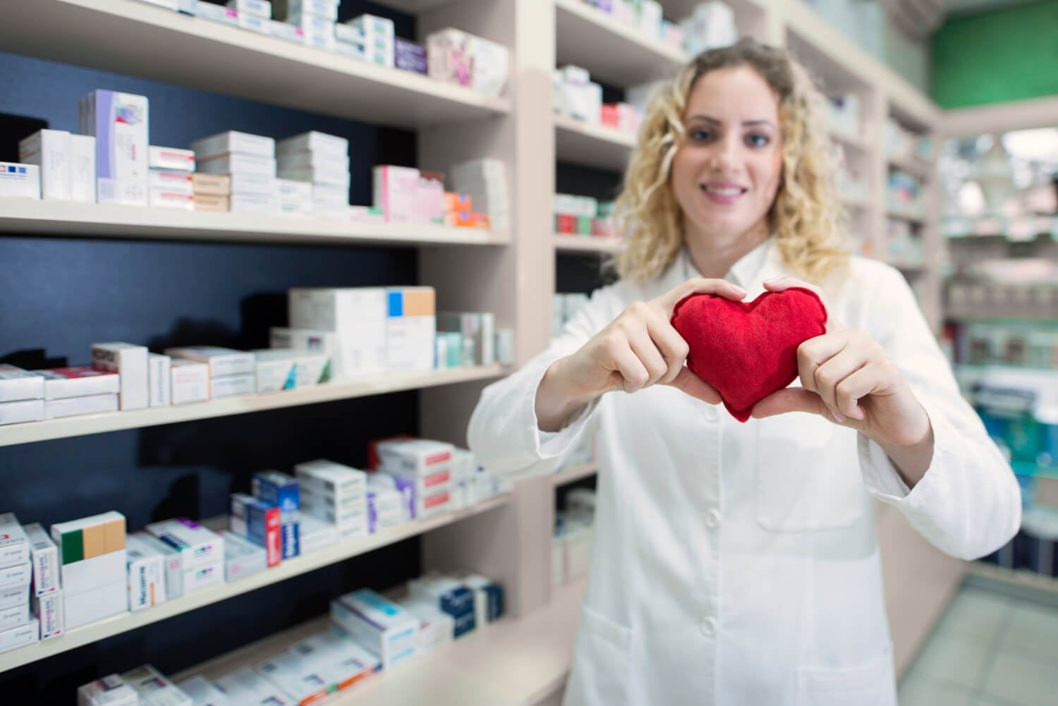 female-pharmacist-holding-heart-promoting-cardiovascular-medications-successful-treatment