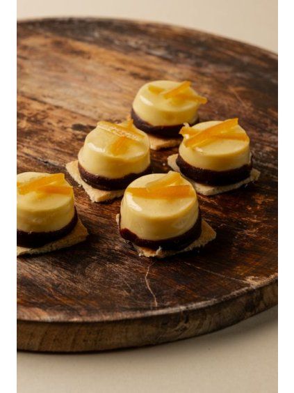 Mini orange cheesecake on gluten free biscuit