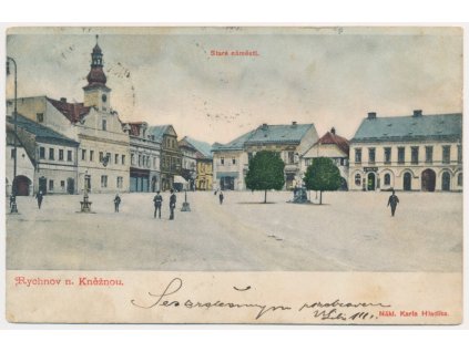 57 - Rychnov nad Kněžnou, oživená partie z náměstí, prošlá poštou 1900