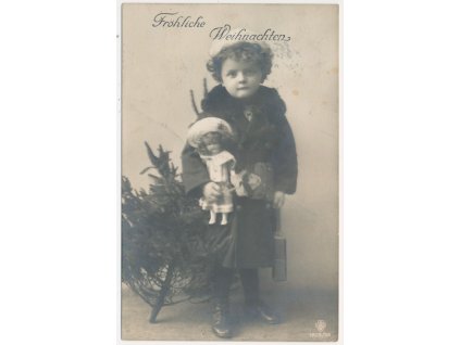 Fröhliche Weihnachten, holčička s panenkou u stromečku, cca 1913