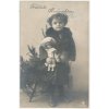 Fröhliche Weihnachten, holčička s panenkou u stromečku, cca 1913