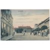 27 - Kladensko, Unhošť, oživená ulice s obchody, cca 1922