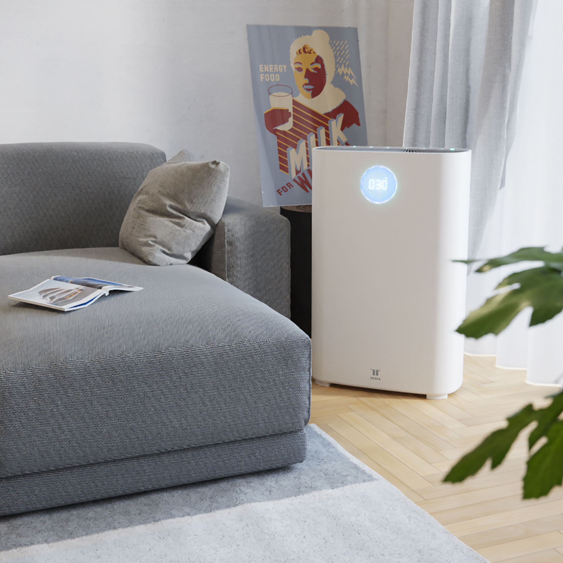 Čistička vzduchu Tesla Smart Air Purifier Pro XL stojící vedle sedačky