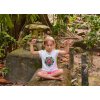 t shirt mockup of a little girl meditating in the jungle 45038 r el2