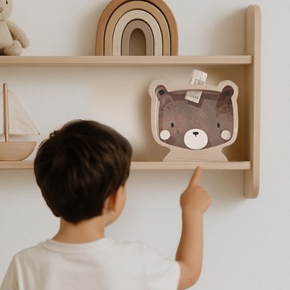 Boy pointingOnBear shelf 2 sq