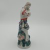 Dívka s květem. Soška. Porcelán.