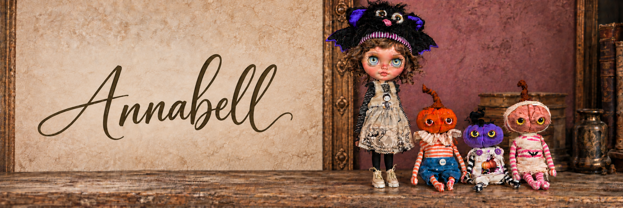 Annabell — a handmade custom doll in a bat hat with three curious pumpkin creatures