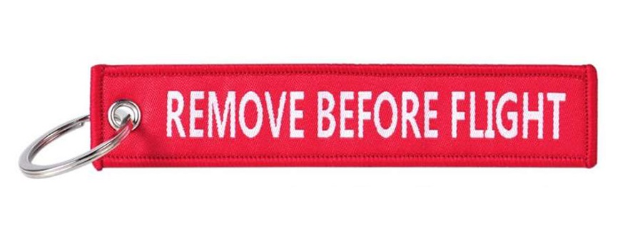 FOSCO Přívěšek na klíče (letecká plomba) REMOVE BEFORE FLIGHT