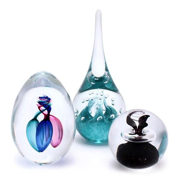 Unique Bohemia Glass pieces. Choose from an offer of several sets of coloured glass paperweights.