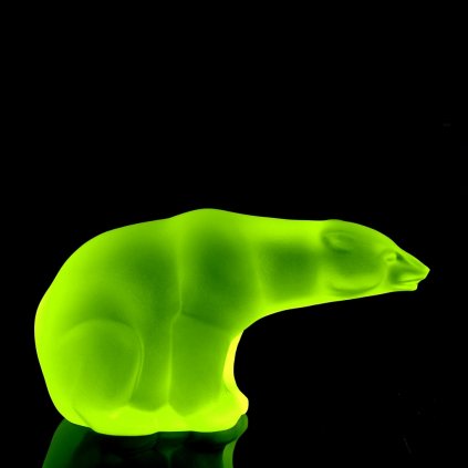 Art Deco uranium glass polar bear figurine by H. Hoffmann with strong UV glow