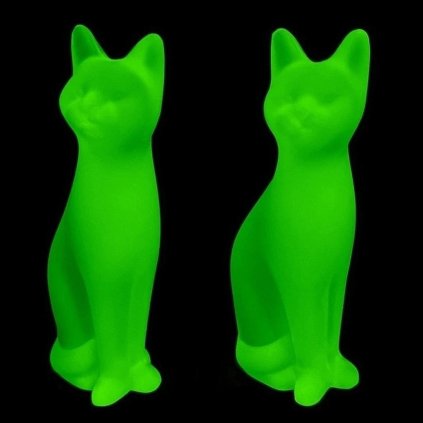 Uranium glass Art Deco sitting cat figurines set of two by H. Hoffmann glowing under UV light