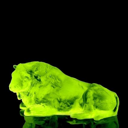 Uranium glass Art Deco lying buffalo figurine by H. Hoffmann glowing under UV light