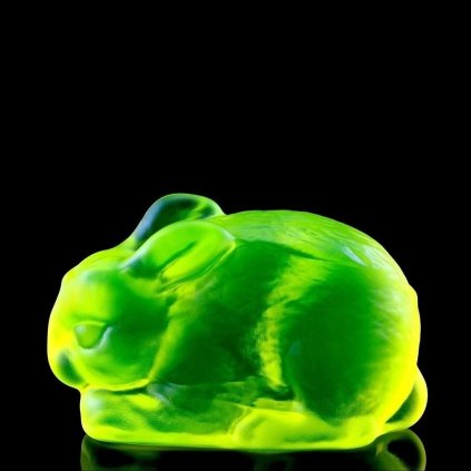 Art Deco Bohemian uranium glass bunny figurine made from yellow uranium glass with strong neon UV glow