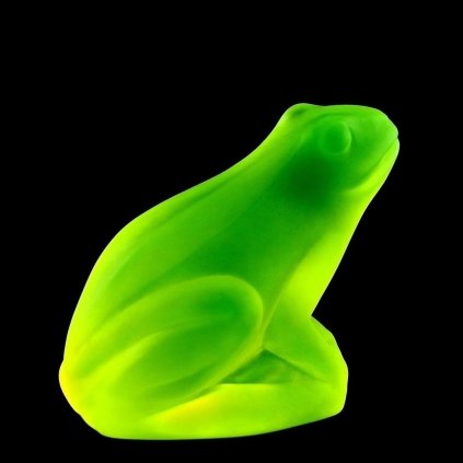 Uranium glass Art Deco frog figurine glowing under UV light
