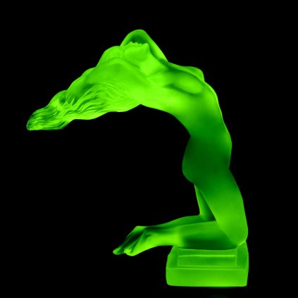 Art Deco nude female hood ornament made of green uranium glass by H. Hoffmann with strong UV glow