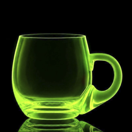 Czech Vaseline uranium glass mug glowing under UV light