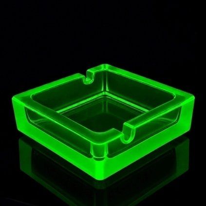 Art Deco Bohemian Vaseline uranium glass ashtray by H. Hoffmann glowing under UV light
