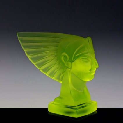 Art Deco Pharaoh head hood ornament made from uranium glass by H. Hoffmann, glowing under UV light