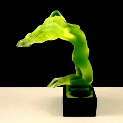 Art Deco nude female hood ornament car mascot in yellow uranium glass with black glass base glowing under UV light
