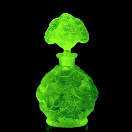 Uranium vaseline glass Art Deco perfume bottle by H. Hoffmann with Cherubs relief, strong UV-glowing uranium glass – artdeco1930.com