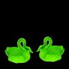 Uranium glass Art Deco swan pair by H. Hoffmann glowing under UV light