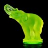 Art Deco uranium glass elephant figurine by H. Hoffmann glowing under UV light