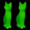 Uranium glass Art Deco sitting cat figurines set of two by H. Hoffmann glowing under UV light