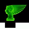 Blue uranium glass Art Deco Pharaoh head hood ornament on black glass base showing green UV glow