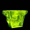 Uranium vaseline glass Art Deco double-sided face bowl, Lalique-style sculptural mask design, strong UV glow — artdeco1930.com