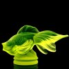 Detail of Art Deco uranium glass fish figurine showing sculpted scales and UV glow