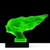 Side view of Art Deco Speed Girl hood ornament in green uranium glass on black glass base by H. Hoffmann with strong UV glow