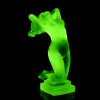 Side view of Art Deco nude female hood ornament in green uranium glass by H. Hoffmann with strong UV glow