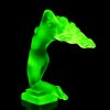 Rear view of Art Deco nude female hood ornament in green uranium glass by H. Hoffmann with strong UV glow