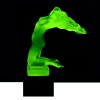 Side view of Art Deco nude female hood ornament in green uranium glass on black glass base by H. Hoffmann with strong UV glow