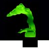 Art Deco nude female hood ornament made of green uranium glass on black glass base by H. Hoffmann with strong UV glow