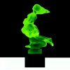 Side view of Art Deco Lovers hood ornament made of green uranium glass on black glass base by H. Hoffmann with UV glow