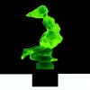 Art Deco Lovers hood ornament in green uranium glass on black glass base by H. Hoffmann with strong UV glow